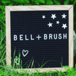 Bell + Brush spelled out on a letterboard.