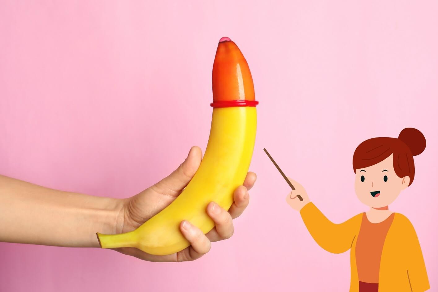 A teacher pointing at a condom with a banana on it for the practical demonstrates of sex education class.