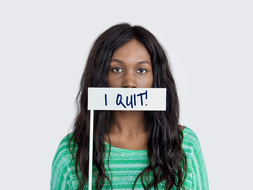 A teacher who listened to the signs and quit her job with a sign saying "I quit!".