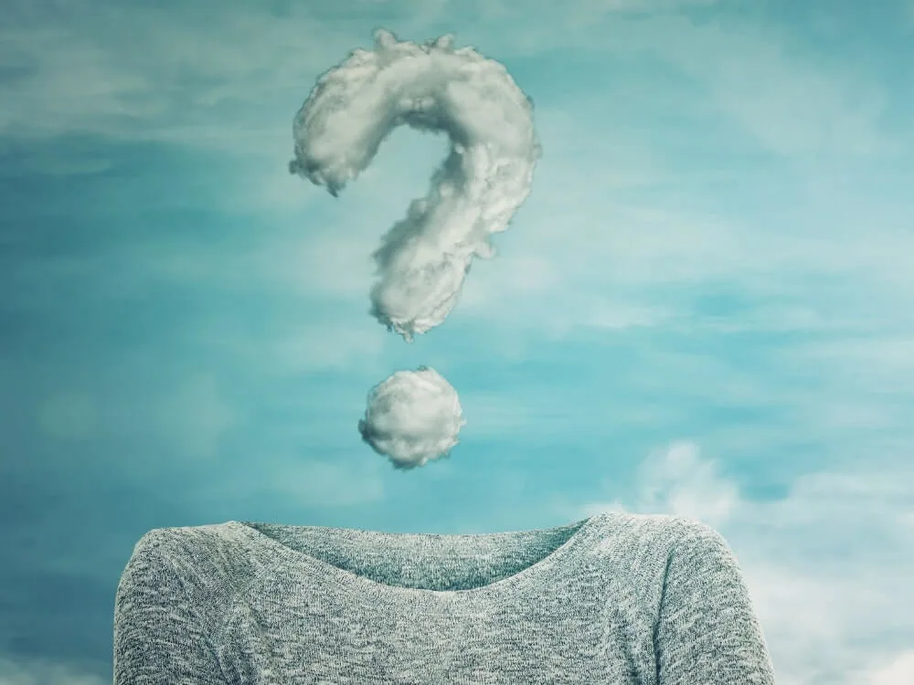 A jumper with a question mark of clouds floating above where the head should be.
