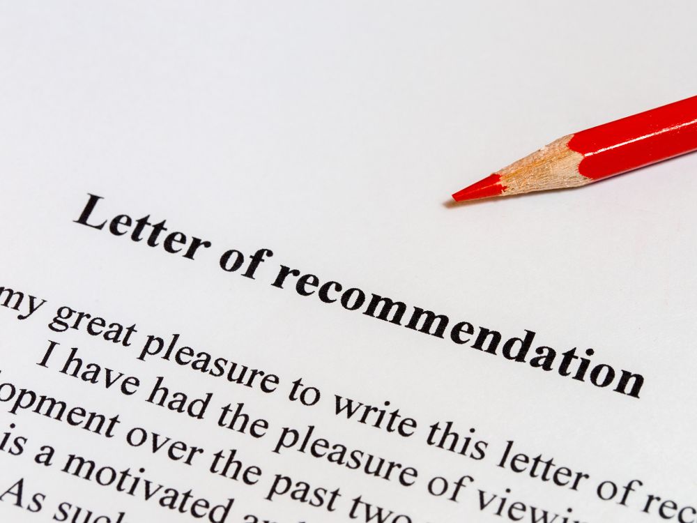 A teacher's recommendation letter for a student with the introduction and a red pencil on top.